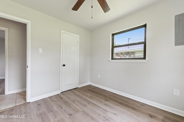 120 Clower Ave, Long Beach, MS 39560 - unfurnished bedroom with electric panel, wood finished floors, a closet, and ceiling fan