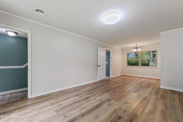 120 Clower Ave, Long Beach, MS 39560 - unfurnished room with a chandelier, wood finished floors, and ornamental molding