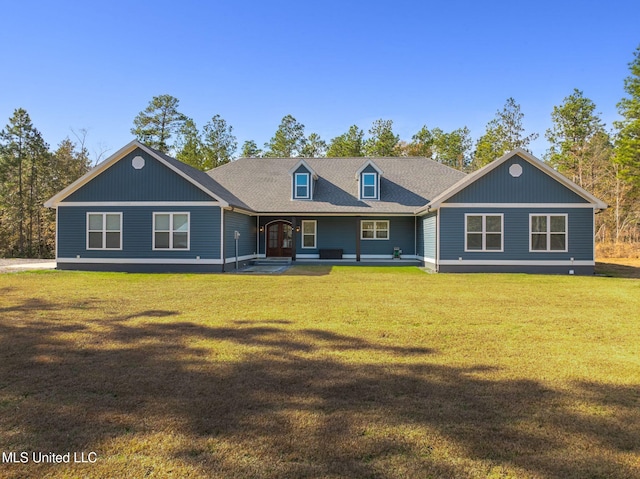 back of property featuring a lawn and a porch