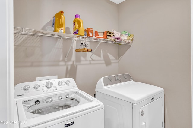 laundry room with separate washer and dryer