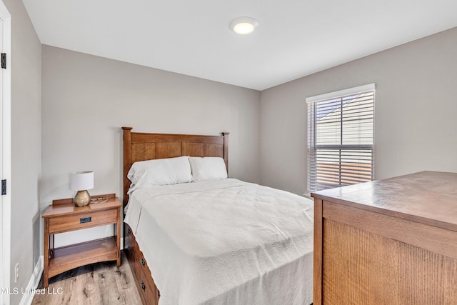 bedroom with light wood-type flooring