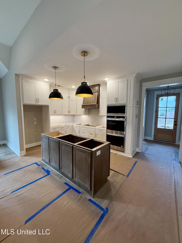 4263 S Bolivar Trl, Olive Branch, MS 38654 - kitchen with stainless steel appliances, white cabinetry, baseboards, and decorative light fixtures