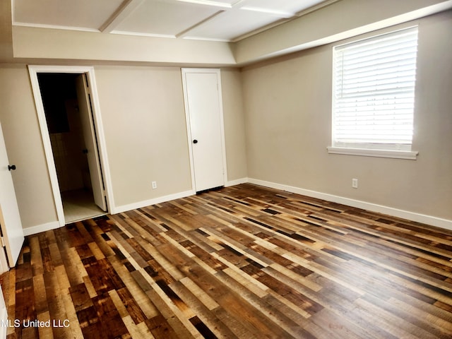 spare room with dark hardwood / wood-style floors