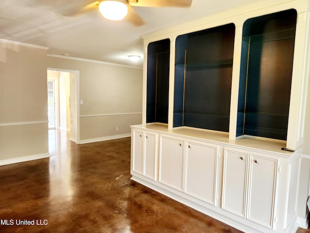 empty room with ceiling fan and ornamental molding