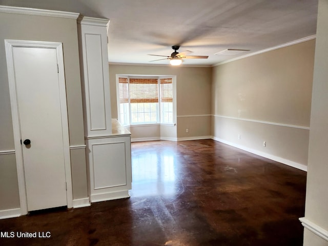 empty room featuring crown molding and ceiling fan