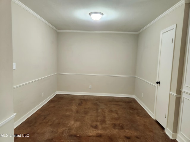 carpeted spare room with crown molding