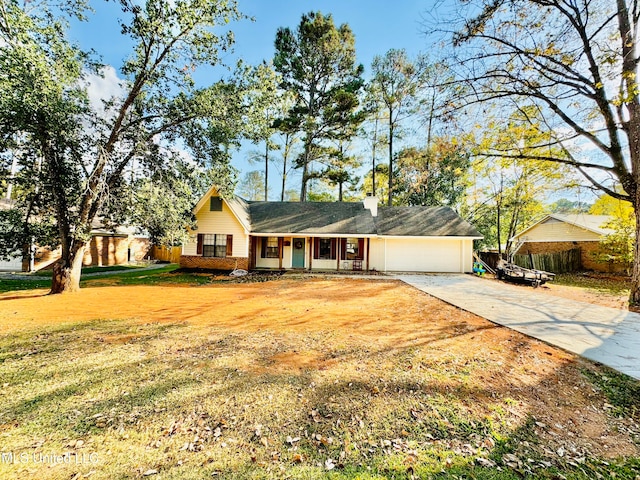 ranch-style home featuring a front yard and a garage