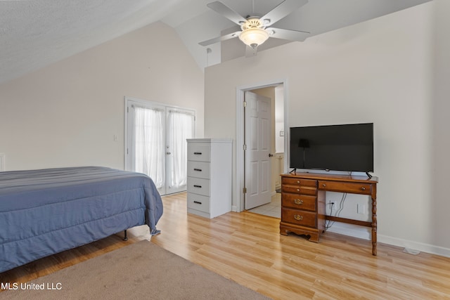 bedroom with a textured ceiling, high vaulted ceiling, light wood-type flooring, and ceiling fan