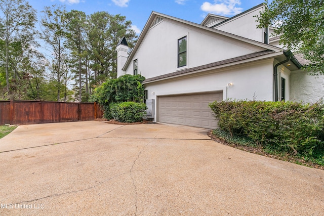 view of property exterior with a garage