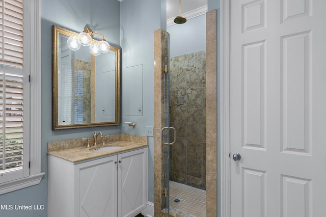 bathroom with walk in shower and vanity