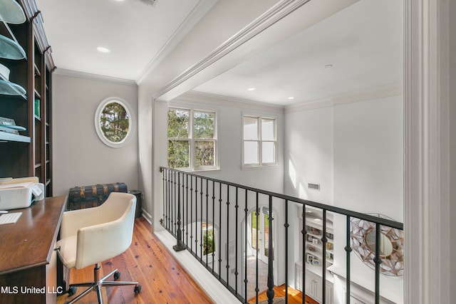 office space featuring hardwood / wood-style floors and crown molding