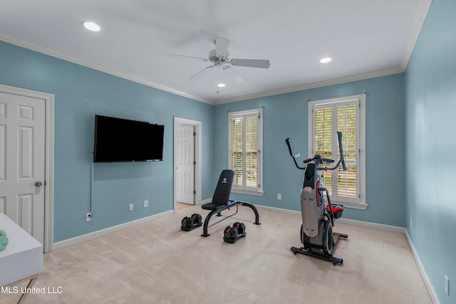 exercise room featuring ceiling fan, light carpet, and ornamental molding