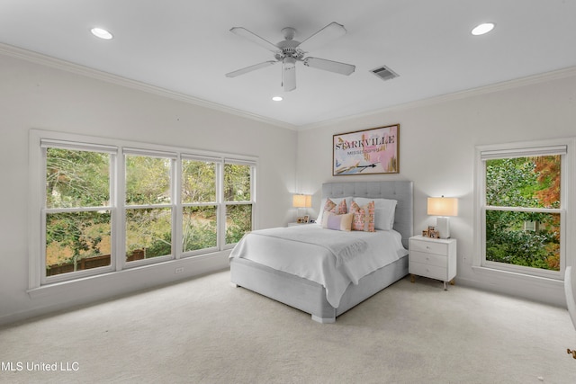 bedroom with ceiling fan, light carpet, and crown molding