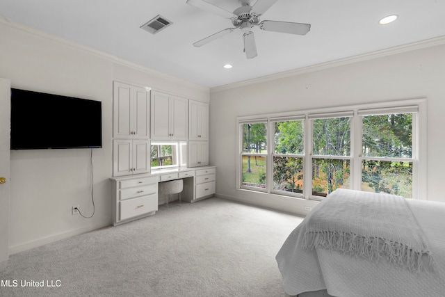 bedroom featuring multiple windows, ceiling fan, and crown molding