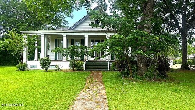 751 S Main St, Grenada, MS 38901 - neoclassical / greek revival house with covered porch and a front yard