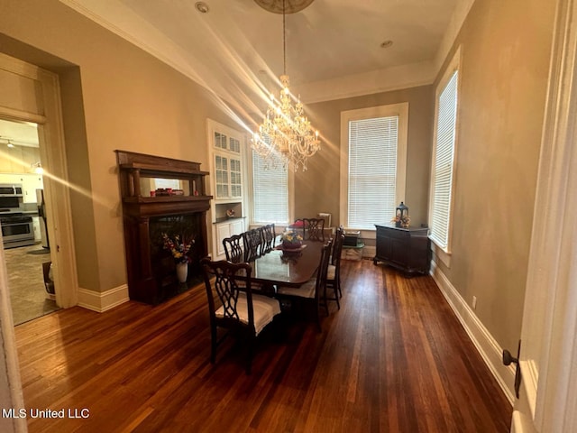 751 S Main St, Grenada, MS 38901 - dining area with a chandelier, wood finished floors, and baseboards