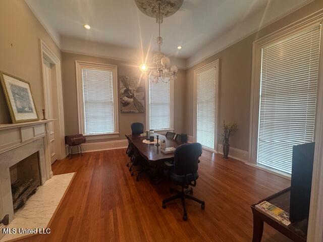 751 S Main St, Grenada, MS 38901 - dining space featuring a chandelier, baseboards, wood finished floors, a high end fireplace, and recessed lighting