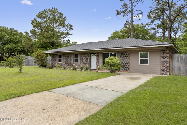 100 Grand Teton Dr, Ocean Springs, MS 39564 - single story home with brick siding, driveway, fence, and a front yard