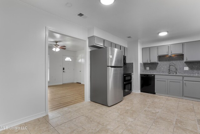 100 Grand Teton Dr, Ocean Springs, MS 39564 - kitchen with black appliances, gray cabinetry, a sink, and visible vents
