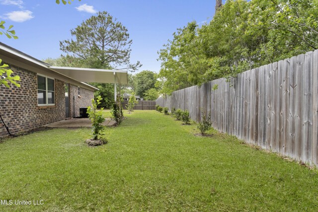 100 Grand Teton Dr, Ocean Springs, MS 39564 - view of yard featuring a patio area and a fenced backyard