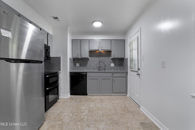 100 Grand Teton Dr, Ocean Springs, MS 39564 - kitchen with visible vents, a sink, gray cabinetry, tasteful backsplash, and black appliances