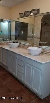 bathroom with vanity and tile patterned floors