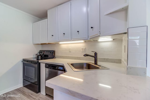 229 Lakeside Villa Unit E, Diamondhead, MS 39525 - kitchen with decorative backsplash, white cabinets, black electric range, a sink, and dishwasher