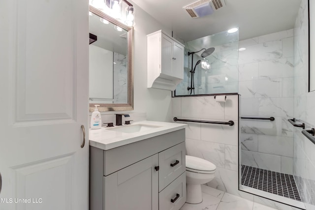 bathroom featuring vanity, toilet, tile walls, and tiled shower