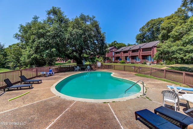 229 Lakeside Villa Unit E, Diamondhead, MS 39525 - community pool featuring a patio and fence