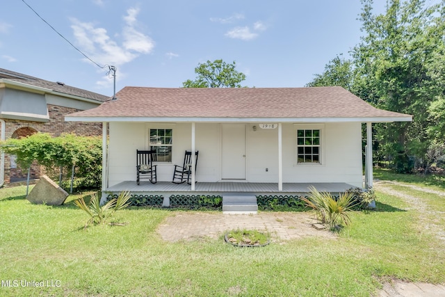 view of front of property with a front yard and a porch