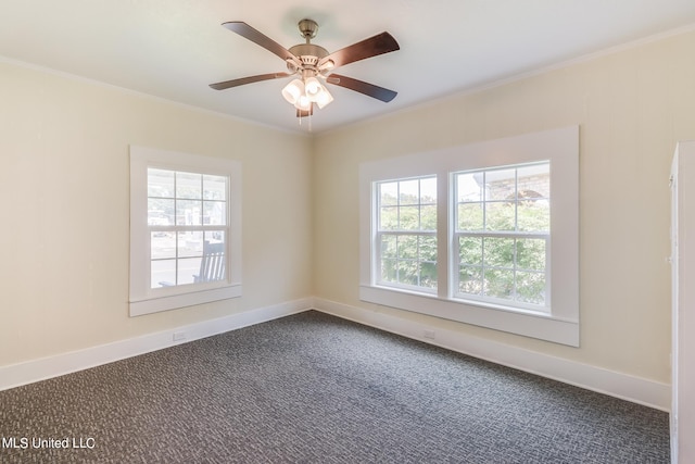 empty room featuring ornamental molding, ceiling fan, plenty of natural light, and carpet floors