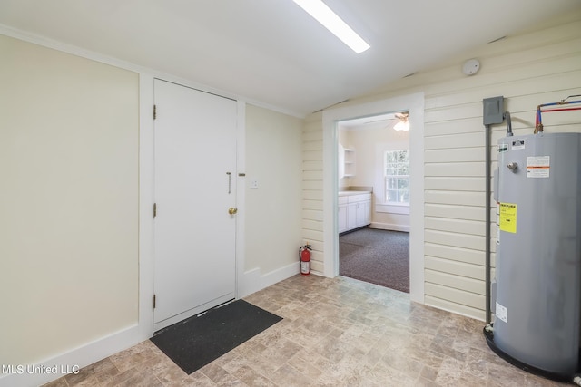 interior space with water heater, vaulted ceiling, and ceiling fan