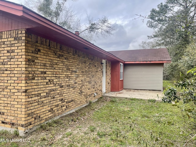 view of home's exterior with brick siding