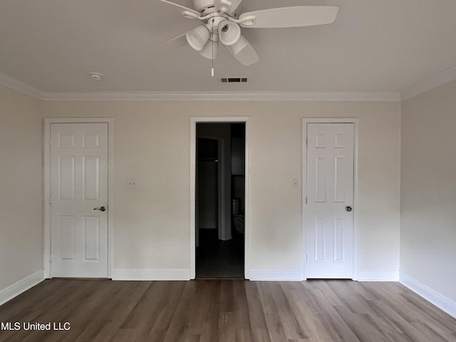 1620 Porpoise St, Ocean Springs, MS 39564 - unfurnished bedroom featuring ornamental molding, wood finished floors, baseboards, and ceiling fan