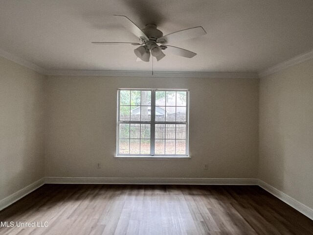 1620 Porpoise St, Ocean Springs, MS 39564 - unfurnished room with dark wood-style flooring, ceiling fan, baseboards, and ornamental molding