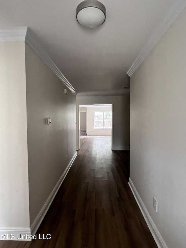 1620 Porpoise St, Ocean Springs, MS 39564 - hallway with dark wood finished floors, crown molding, and baseboards