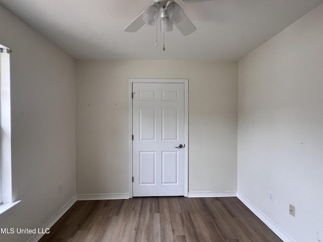 1620 Porpoise St, Ocean Springs, MS 39564 - unfurnished room featuring wood finished floors, a ceiling fan, and baseboards