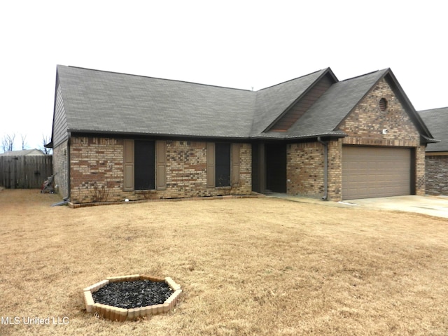 ranch-style home with an attached garage, driveway, and brick siding