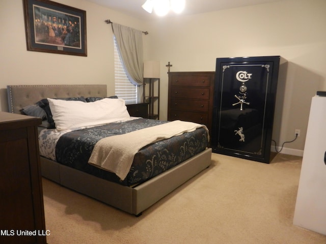 carpeted bedroom featuring baseboards