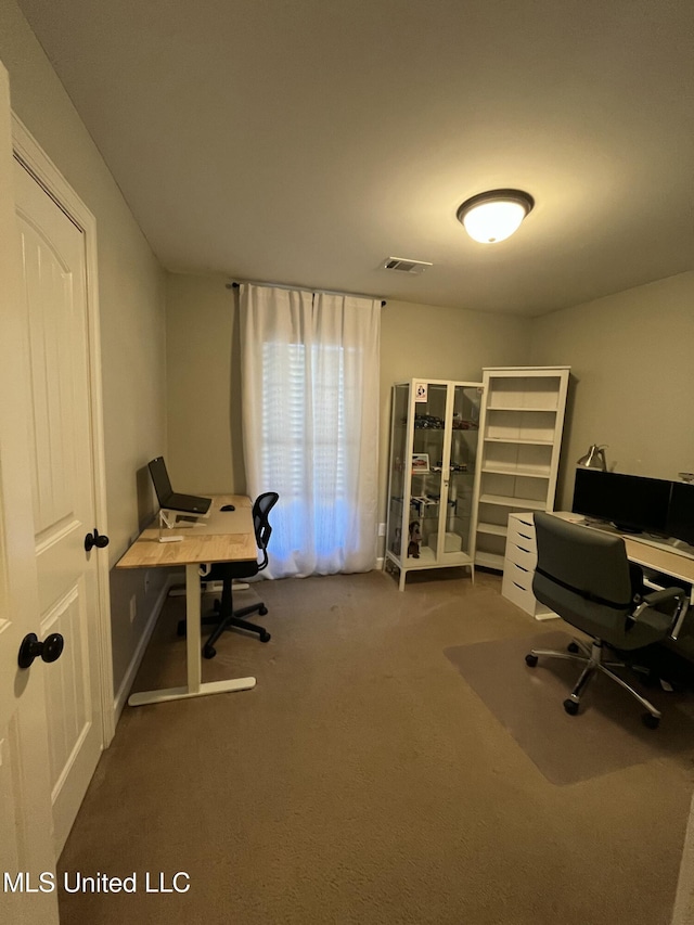 office area with carpet floors and visible vents