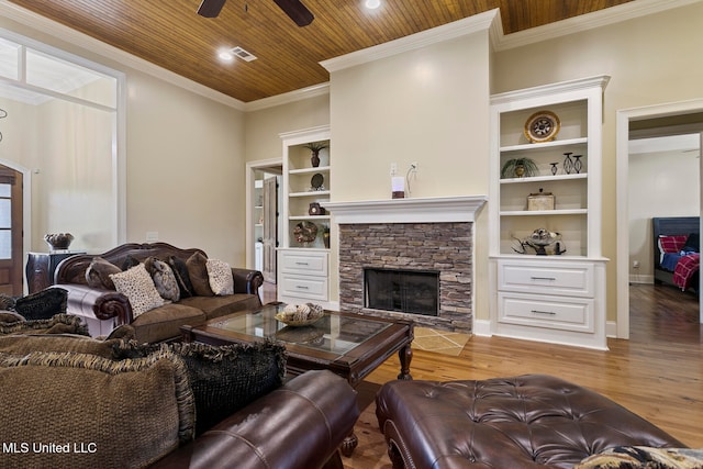 living room featuring wood ceiling, hardwood / wood-style floors, ceiling fan, built in features, and a fireplace