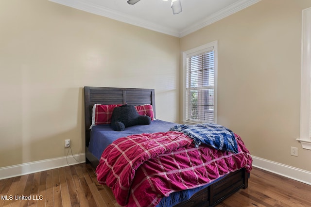 bedroom featuring crown molding, ceiling fan, and dark hardwood / wood-style flooring