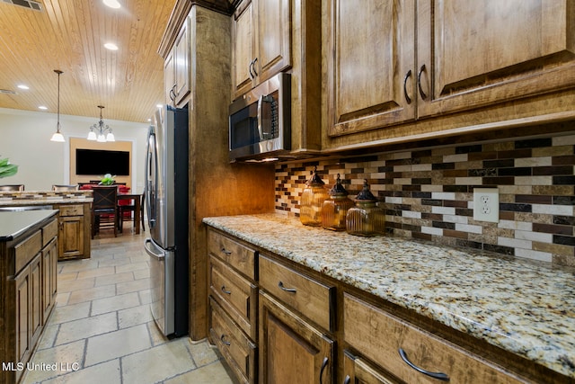 kitchen with light stone countertops, appliances with stainless steel finishes, wooden ceiling, a notable chandelier, and decorative backsplash