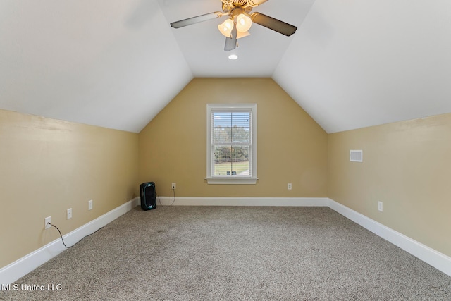 additional living space with ceiling fan, lofted ceiling, and carpet floors