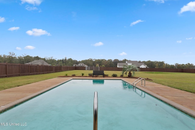 view of swimming pool featuring a lawn