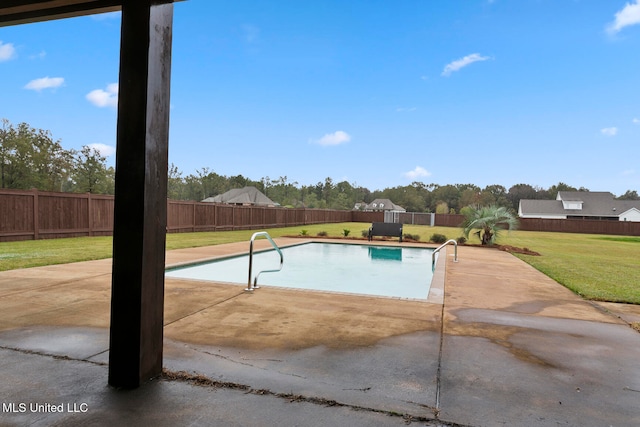 view of swimming pool featuring a patio and a lawn