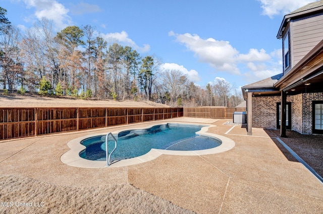 view of pool featuring central AC unit and a patio area