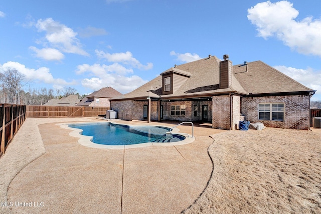 view of swimming pool featuring a patio area and central AC unit