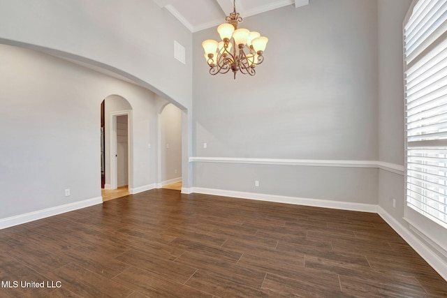 spare room with a notable chandelier