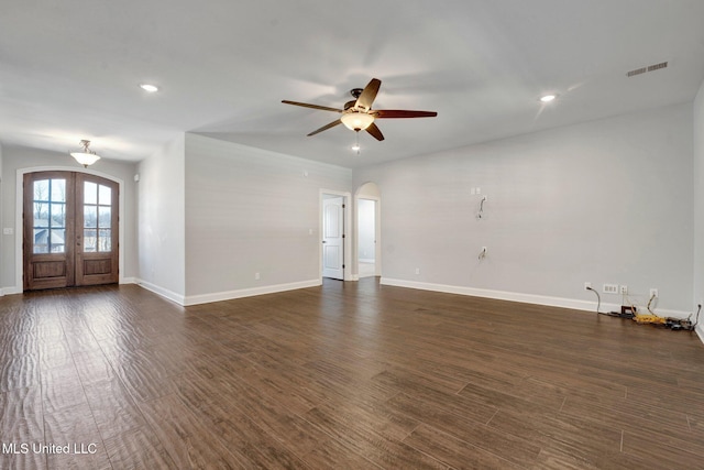 interior space with dark wood-type flooring, ceiling fan, and french doors